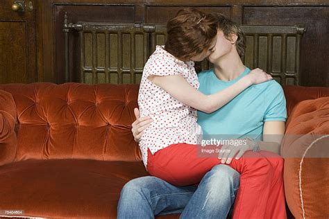 Teenagers Kissing On A Sofa Bildbanksbilder Getty Images