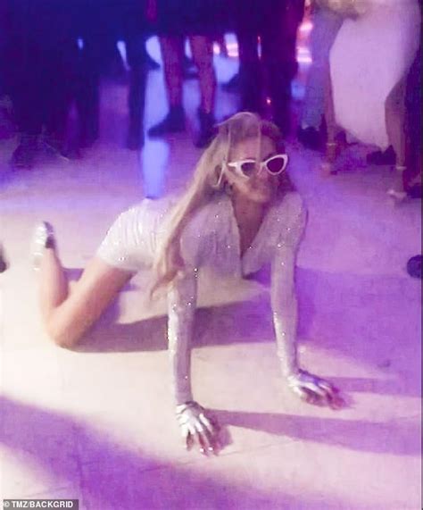 paris hilton writhes around on the floor as she shows off her sexiest