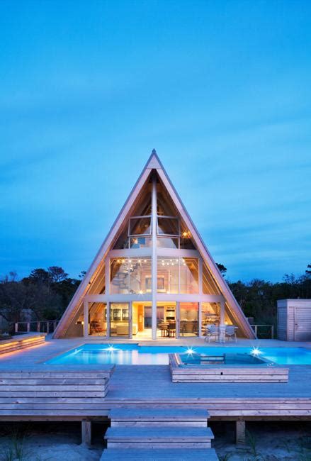 beautiful beach house design blending glass walls  striking  frame structure