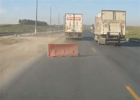 video wind drag  truck hurls barrier  traffic