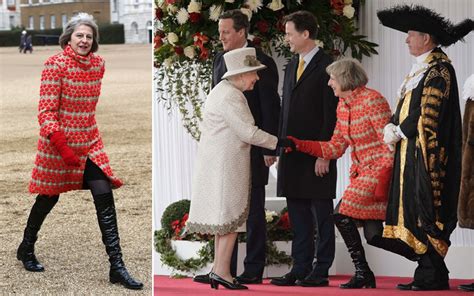 theresa may wears thigh high boots to greet queen and