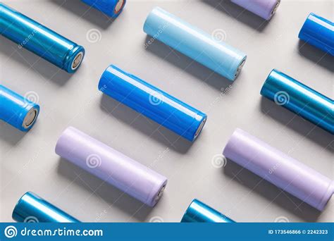 colorful  nickel metal hydride ni mh battery grey background flat lay stock photo image