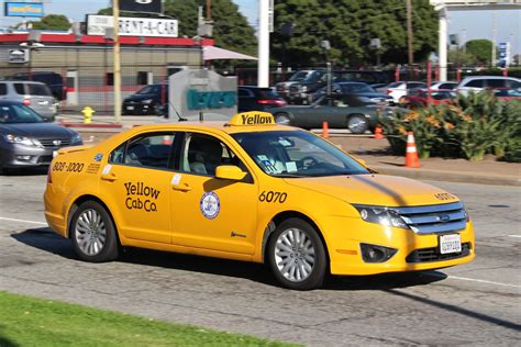 yellow cab  ford fusion taxi headed  los angeles airp  cal metro flickr