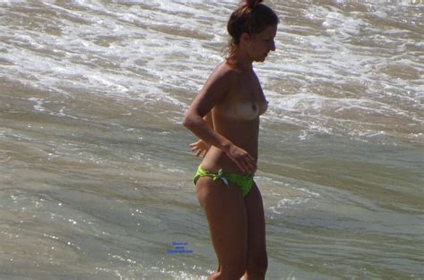 topless in a public beach in southern italy september