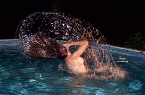 nude girl tossing wet hair in pool july 2008 voyeur