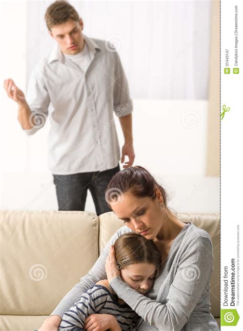 Mother Protecting Her Daughter From Angry Father Royalty Free Stock