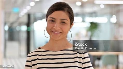 Portrait Of Appreciative Indian Woman Saying Yes By Shaking Head Stock