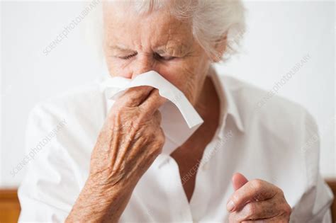 Elderly Woman Blowing Her Nose Stock Image C034 2525 Science