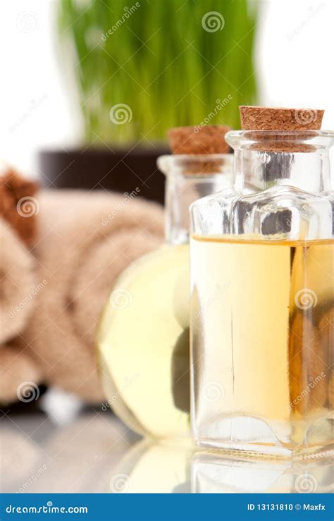 essential spa oils  bottles stock photo image  reflection close