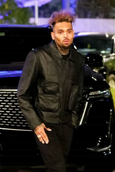chris brown looks unrecognizable in new photos from drake s billboard