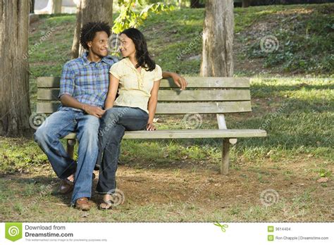 couple  park bench stock photo image  bench adult