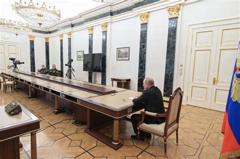 Photos Putin Keeps His Distance During Meetings
