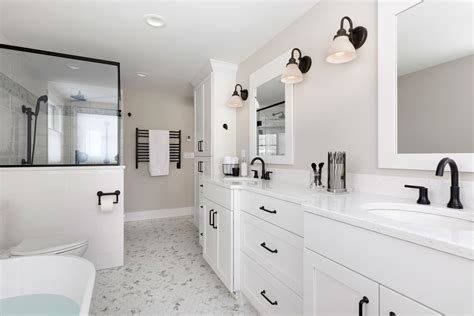 spacious white master bathroom crystal cabinets