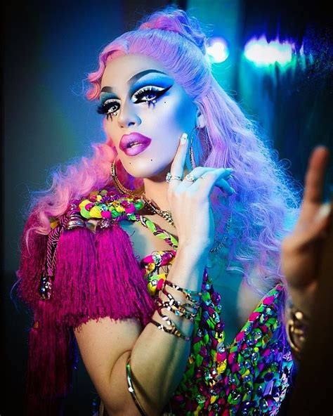 woman  bright makeup  colorful hair  posing   camera   dark room