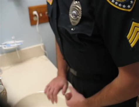 cop stroking his dick in a bathroom