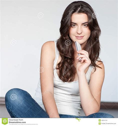 sexy brunette woman holding cell phone stock image 16900513