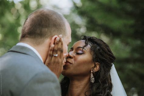 Wedding Couple Kissing By Stocksy Contributor Leah Flores Stocksy