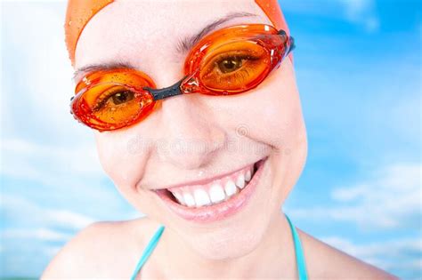 A Winner Young Cheerful Female Swimmer In An Orange Swimming Cap And