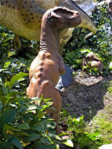 adult theropod statue