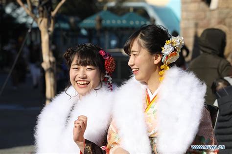 japanese girls dressed up celebrate coming of age at tokyo disneyland
