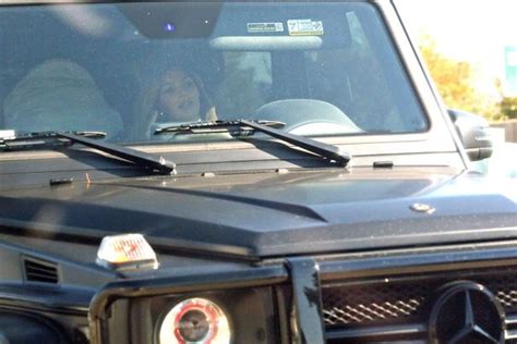 naughty kim kardashian talks on mobile phone while driving her huge car in la mirror online