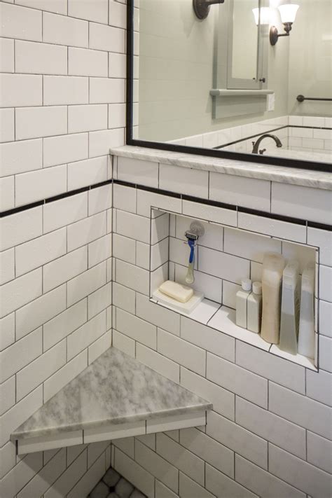 small niche tucked   partial height wall   shower