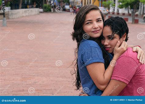 latin lesbian couple embracing in the city stock image image of