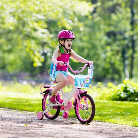 child riding bike kid  bicycle stock photo image  garden