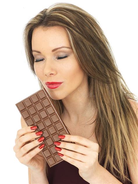 Young Attractive Young Woman Holding A Milk Chocolate Bar Stock Image