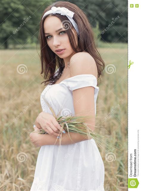 Beautiful Sweet Girl With Dark Hair In A White Summer