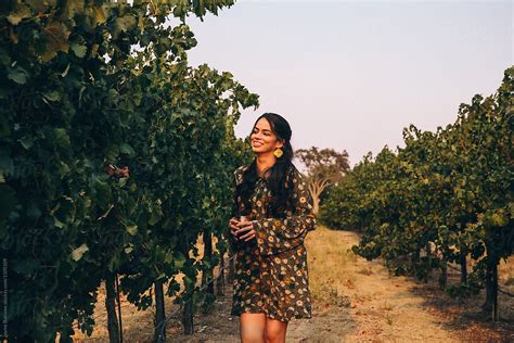 pretty latina woman in a vineyard del colaborador de stocksy jayme