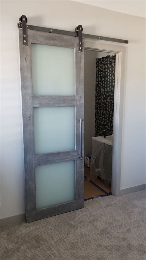 sliding barn door with frosted privacy glass by bds puertas de