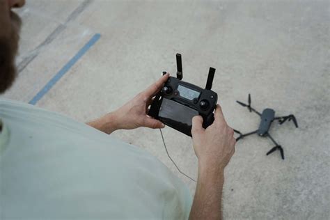 camera person holding drone remote control videographer image  photo