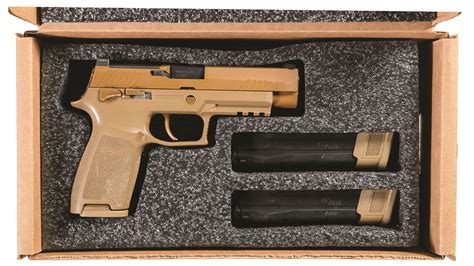 army issued sig sauer  semi automatic pistol  box rock