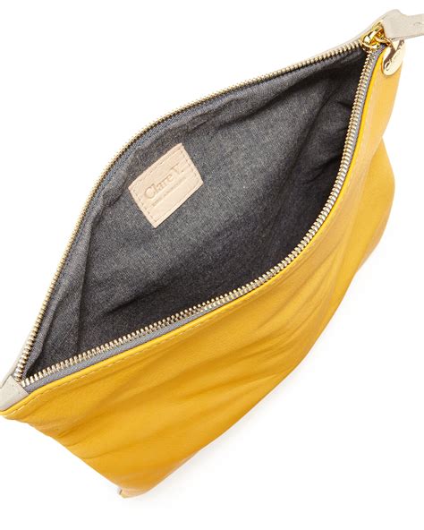 clare   tone tumbled leather fold  clutch bag  yellow null lyst