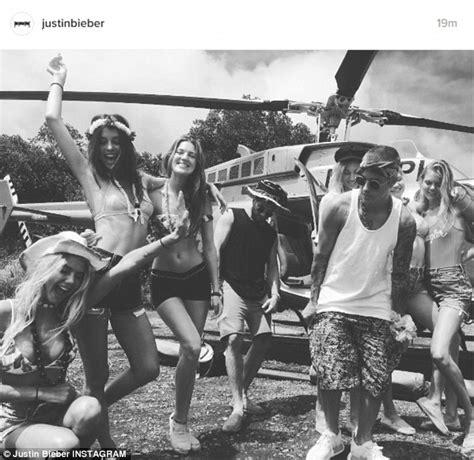 Justin Bieber Catches A Helicopter Ride With Bikini Beauties During His