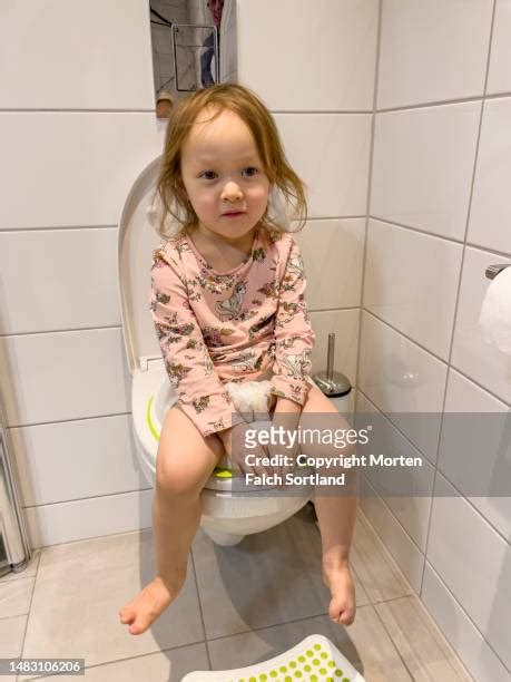 Girl Peeing On Toilet Photos And Premium High Res Pictures Getty Images