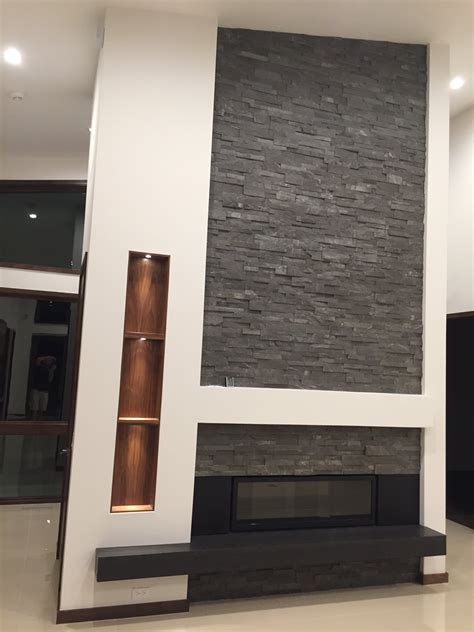 charcoal stacked stone fireplace carene