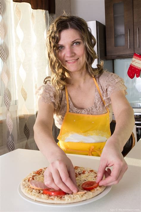 aga is a beautiful sexy blonde who is making pizza after