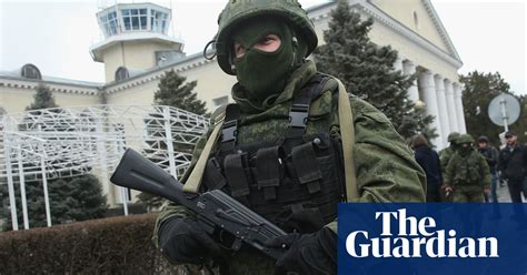 masked gunmen take control of crimea airports in pictures world