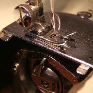 sewing machine needle hits bobbin case find  solution