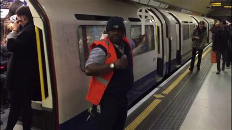singing train guard london underground singing train guard