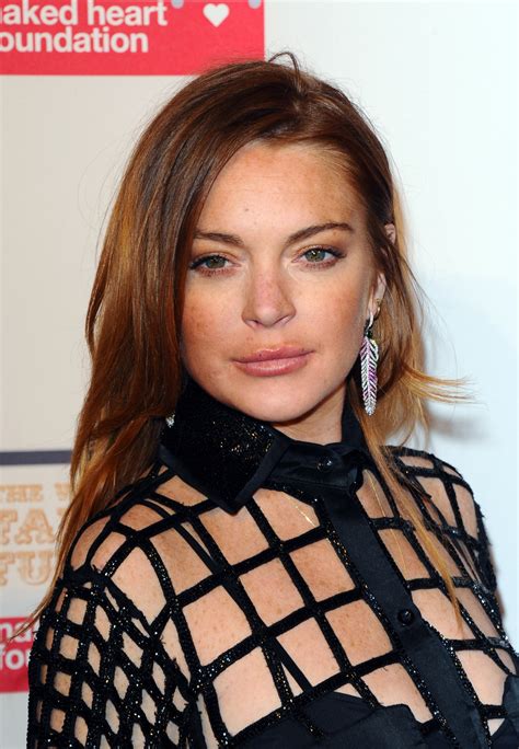 lindsay lohan shares topless selfie to celebrate opening