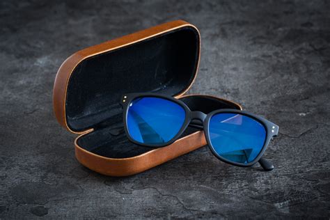 sunglasses komono renee black rubber blue mirror