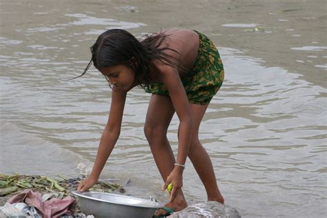 india slum girl bathing