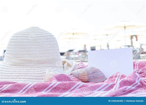 summer vacation still life white straw hat seashell on red and white