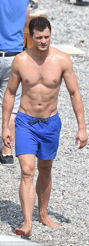 jamie dornan shows off ripped physique as he joins wife amelia warner