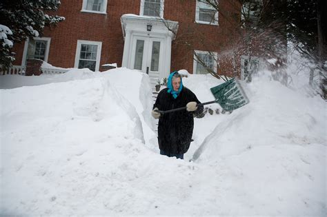 snow continues  pile   boston