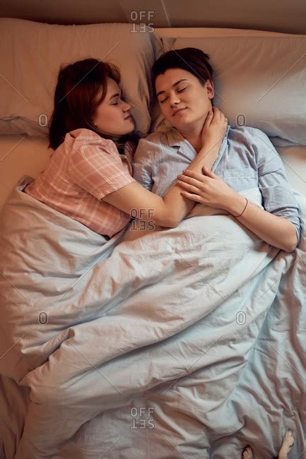 From Above Couple Of Lesbians In Love Resting Sleeping On Soft Bed With