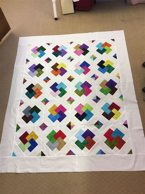 large white quilt   ground  colorful blocks   center